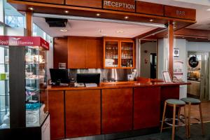 a bar in a store with two stools at SpaHotel Hamina in Hamina
