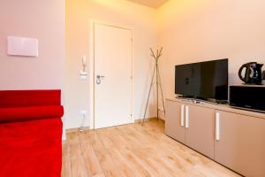 TV a/nebo společenská místnost v ubytování Casa Vino - Gardagate