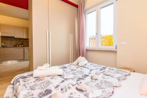 Postel nebo postele na pokoji v ubytování Casa Vino - Gardagate