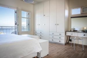 Postel nebo postele na pokoji v ubytování Villa Andromahi