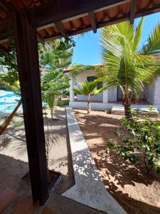 a view of the beach from the porch of a house at B&B Residencia Casa Branca in Sítio