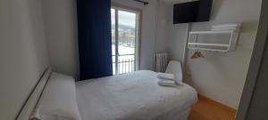 Ένα ή περισσότερα κρεβάτια σε δωμάτιο στο Hotel del Trueno