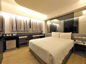 Postelja oz. postelje v sobi nastanitve Hub Hotel Ximen Inn