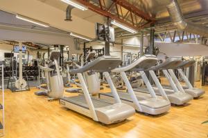 a row of treadmills in a gym at Hotell Moskogen in Leksand