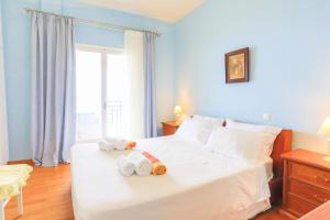 A bed or beds in a room at Villa Natasha