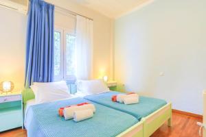 A bed or beds in a room at Villa Natasha