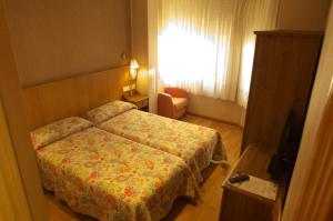 Postel nebo postele na pokoji v ubytování Hostal Orejas