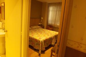 Postel nebo postele na pokoji v ubytování Hostal Orejas