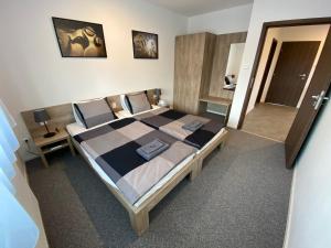 Postel nebo postele na pokoji v ubytování Apartmány Pelhřimov + 5 fotografií