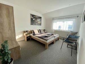 Postel nebo postele na pokoji v ubytování Apartmány Pelhřimov