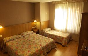 Postel nebo postele na pokoji v ubytování Hostal Orejas