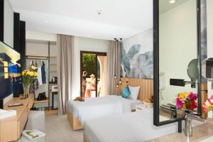 Ein Bett oder Betten in einem Zimmer der Unterkunft Three Corners Rihana Resort El Gouna
