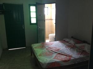 Pousada do Mar tesisinde bir odada yatak veya yataklar