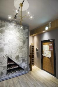 Ένα ή περισσότερα κρεβάτια σε δωμάτιο στο TT Guesthouse旅人時光民宿