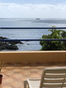 a view of the ocean from a balcony at Splendid Guest Suite with Separate Private Ocean View Terrace in Praia