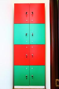 a row of colored cabinets with silver knobs on them at ID Hostel Rostov-on-Don in Rostov on Don