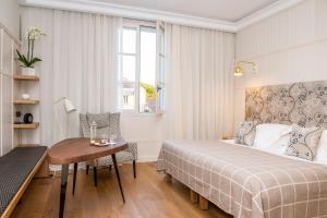 Postel nebo postele na pokoji v ubytování Château Cordeillan-Bages