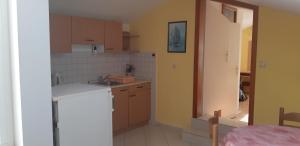 Kuchyň nebo kuchyňský kout v ubytování Studio Apartment Milica