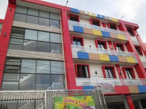 a building with colorful paint on it at Guest House Remaja in Samarinda