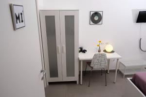 Televízia a/alebo spoločenská miestnosť v ubytovaní DOReMI GuestHouse