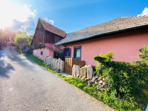 a house with a fence next to a road at Libling Štiavnický in Banská Štiavnica