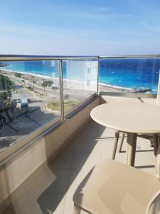 a balcony with a table and a view of the ocean at Europa Hotel in Rhodes Town
