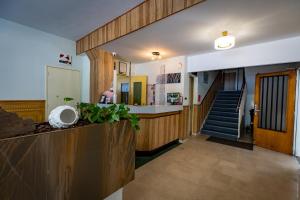 a hallway with a staircase leading to a room at Hotel Christina in Châteauroux