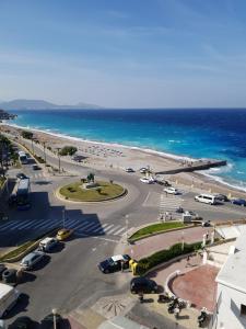 an aerial view of a parking lot next to the beach at Europa Hotel in Rhodes Town