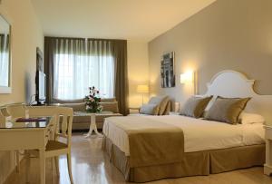 Cama o camas de una habitación en Crisol Jardines de Córdoba