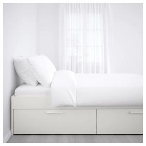 a white bed with white pillows and a window at City Apartment Fully Furnished - Lillestrøm-Strømmen in Lillestrøm