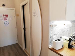 a surfboard sitting on a counter in a kitchen at The Surf Studio - Ericeira in Ericeira