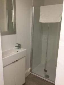 a bathroom with a shower and a sink at Fernville Guest House in Weston-super-Mare