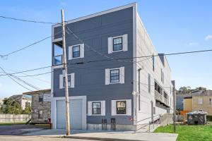 a black and white house with a pole at Stunning Condos Near French Quarter in New Orleans +98 photos