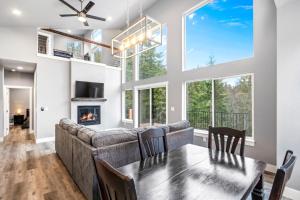 a dining room and living room with a couch and a table at Eagles Nest in Sagle