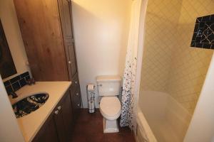 a bathroom with a toilet and a sink and a tub at Closson Studio - Stylish - Near Plaza - Queen bed in Santa Fe