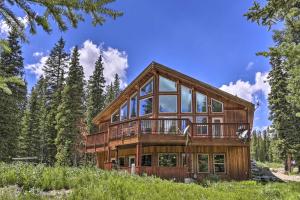 a large wooden house with glass windows at Pristine Breckenridge Home with Hot Tub and Mtn Views! in Breckenridge