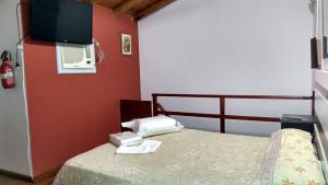 Rúm í herbergi á La Daimalé Apart