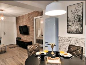 TV a/nebo společenská místnost v ubytování Suite Haus Vargas