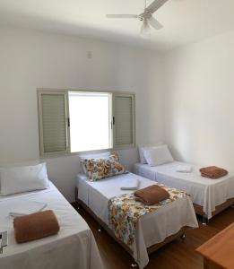 Postel nebo postele na pokoji v ubytování Casa Recanto da Paz
