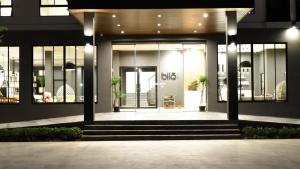 a building with the front door of a building at bliQ Hotel Chanthaburi in Chanthaburi