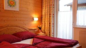 Postel nebo postele na pokoji v ubytování Haus Alpenglück