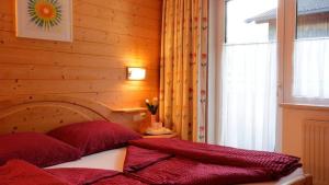 Postel nebo postele na pokoji v ubytování Haus Alpenglück