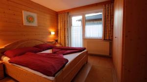Postel nebo postele na pokoji v ubytování Haus Alpenglück