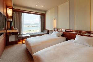 Postel nebo postele na pokoji v ubytování Candeo Hotels Nankai Wakayama