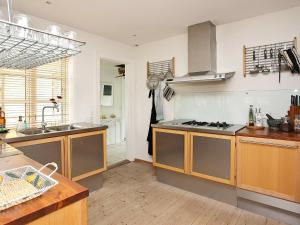 a kitchen with a sink and a stove at 5 person holiday home in Skagen-By Traum in Skagen