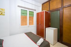 Postel nebo postele na pokoji v ubytování Pensión Ayuntamiento