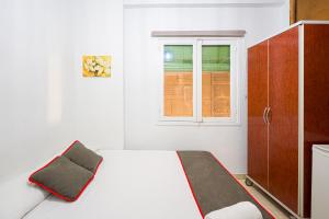 Postel nebo postele na pokoji v ubytování Pensión Ayuntamiento