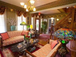 a living room with a couch and a table at The Fairlawn Inn in Hunter +73 photos