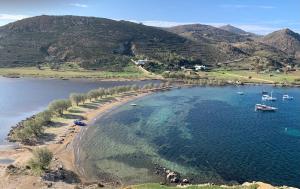 an aerial view of a beach with boats in the water at Patmos Villas in Grikos