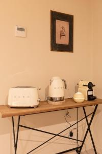 a counter with two toasters and a toaster at Chic Apartments Barcelona in Barcelona